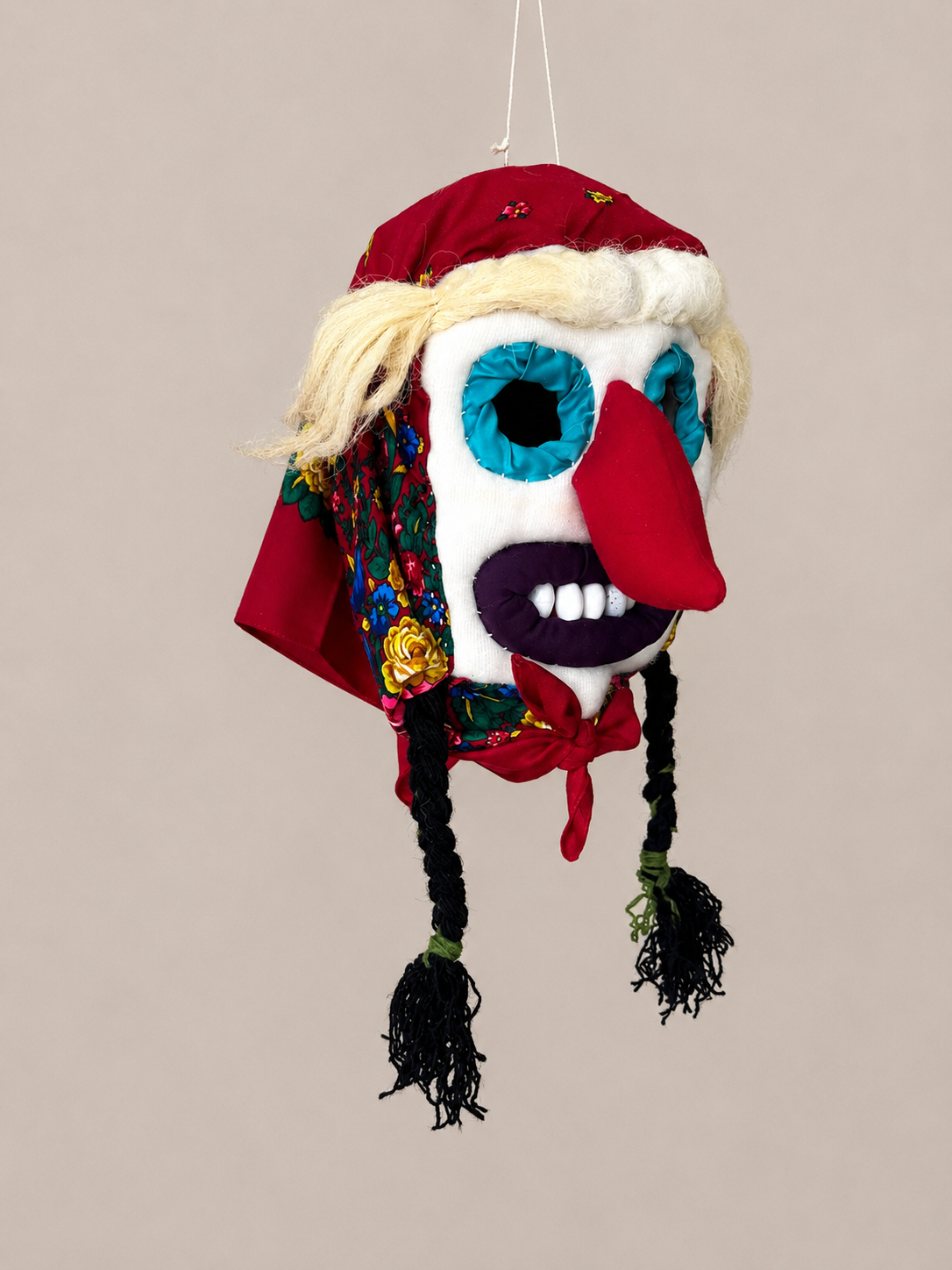 Handmade Romanian Baba folk mask with floral embroidery and colorful tassels