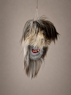 Hanging Romanian Traditional Mask with a neutral background