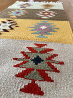 Multicolored patterned rug with geometric design