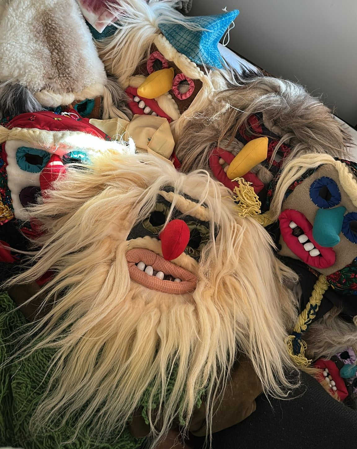 Collection of colorful masks with various designs and textures.
